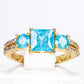 Ring aus goldplattierterr Legierung mit blauem Emporia®-Kristall und weißem Emporia® Kristall