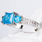 Ring aus goldplattierterr Legierung mit blauem Emporia®-Kristall und weißem Emporia® Kristall