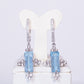 Silberohrringe mit himmelblauem Topas und weißem Topas